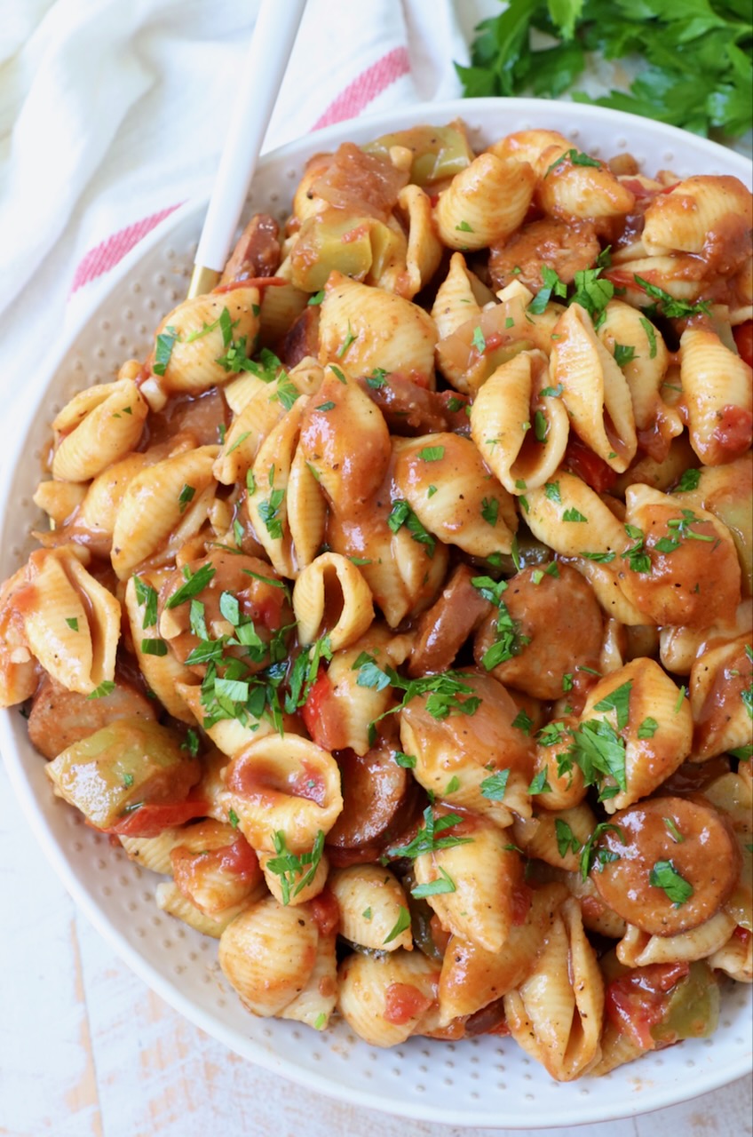 cajun pasta with sauce in a large bowl with a fork