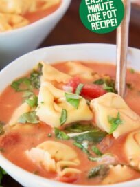 tortellini soup in bowl with spoon