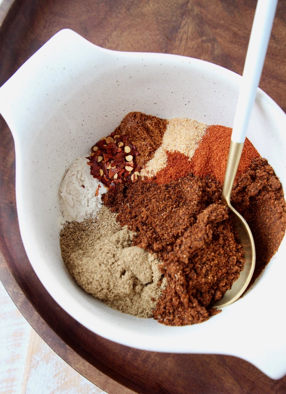 spices separated in bowl with spoon