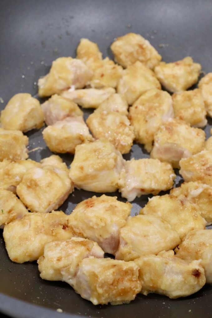 cooked breaded chicken pieces in a skillet