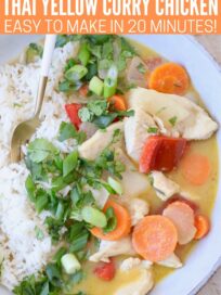 cooked yellow chicken curry with vegetables in bowl with rice