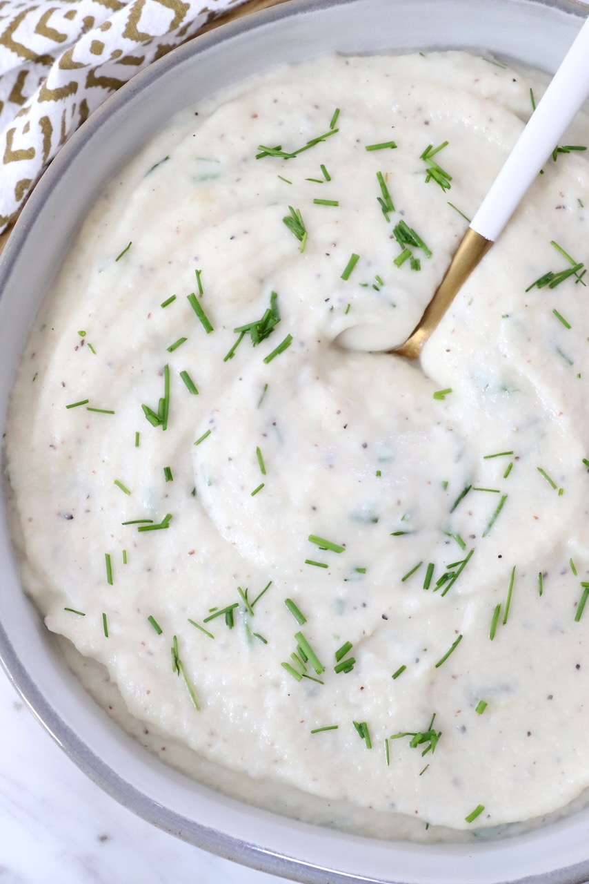 mashed cauliflower in a bowl with a spoon