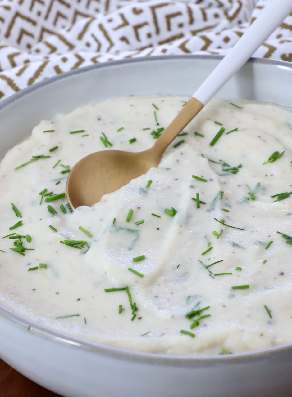 mashed cauliflower in a bowl with a spoon