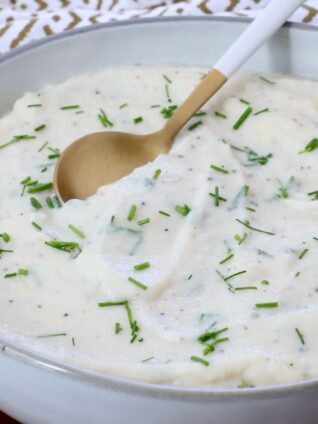 mashed cauliflower in a bowl with a spoon