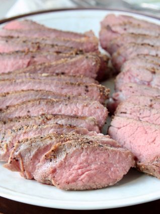 Sliced sous vide tri tip on white plate