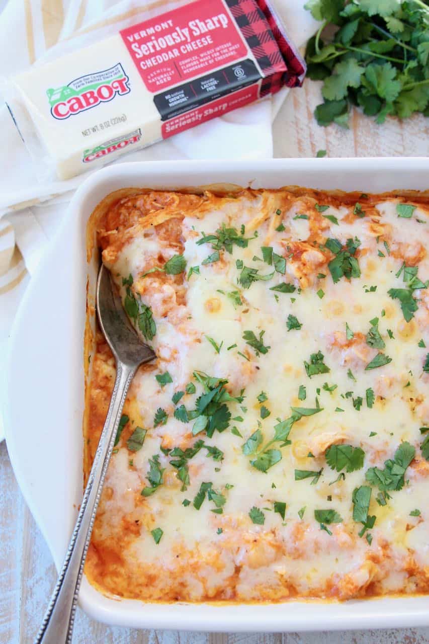 Casserole covered in cheese and chopped cilantro