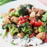 Teriyaki chicken and broccoli over rice on plate