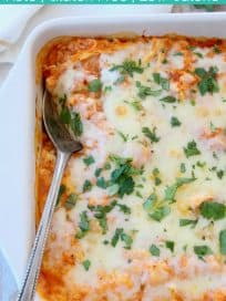Casserole covered with melted cheese and fresh cilantro