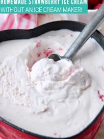 Strawberry ice cream being scooped out of metal pan