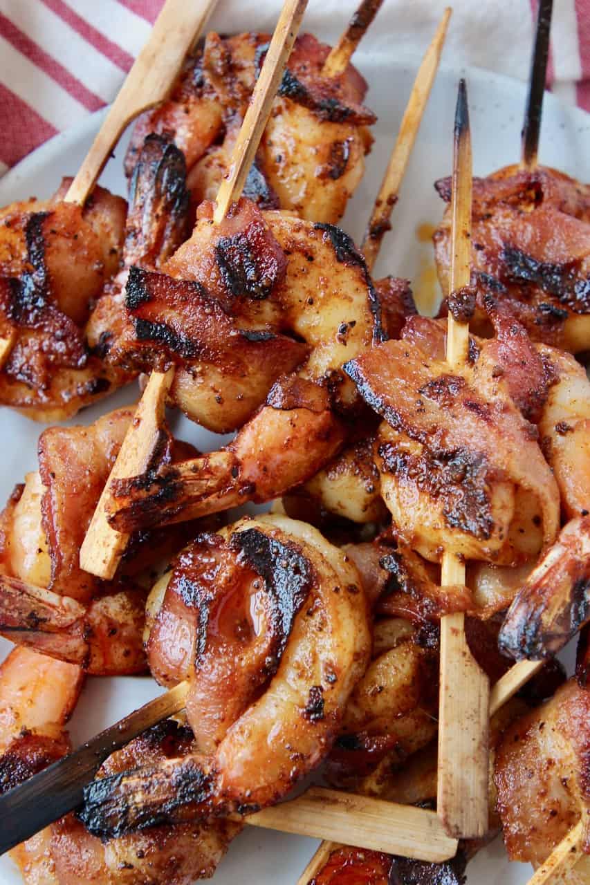 Bacon wrapped shrimp piled on plate