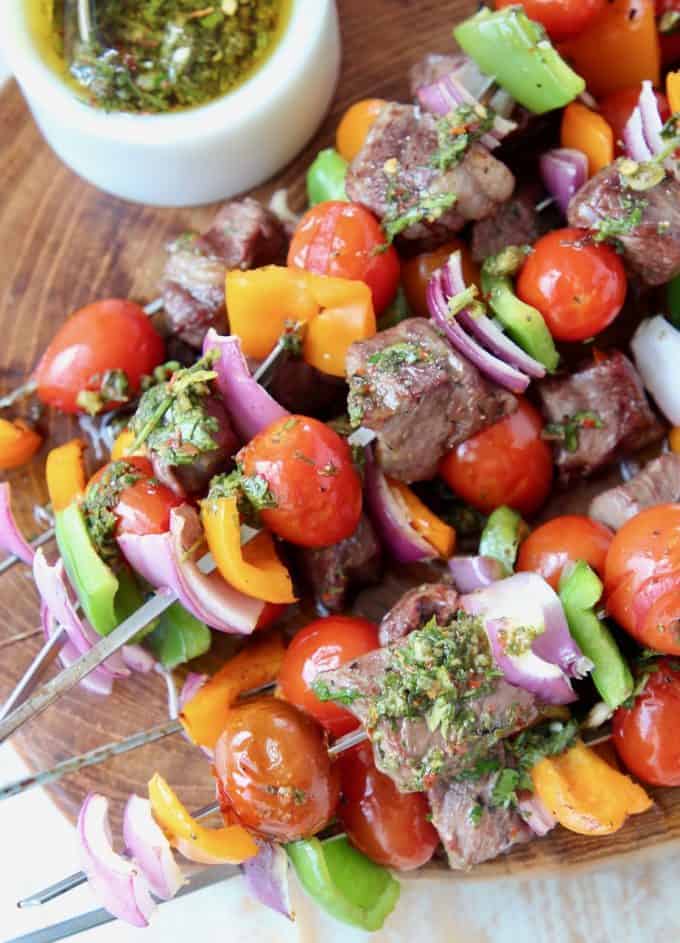 Steak and veggie kabobs stacked on top of each other