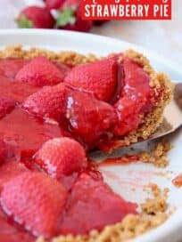 Slice of strawberry pie lifted out of pie plate