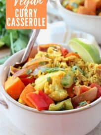curry casserole with vegetables and rice in bowl with fork