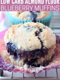 Blueberry muffin in paper liner on wire rack