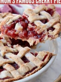 slice of cherry pie lifted out of pie plate