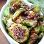 cooked brussel sprouts in serving dish