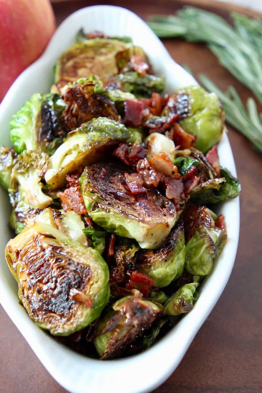 cooked brussels sprouts in dish with cooked bacon
