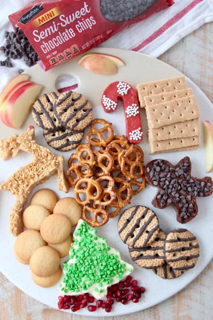 overhead image of holiday dessert board with chocolate chips on the side