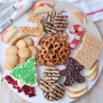 overhead image of holiday dessert board with cream cheese dips