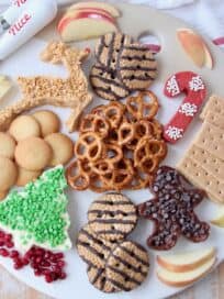 overhead image of holiday dessert board with cream cheese dips
