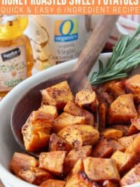 cubes of roasted sweet potatoes in bowl with serving spoon