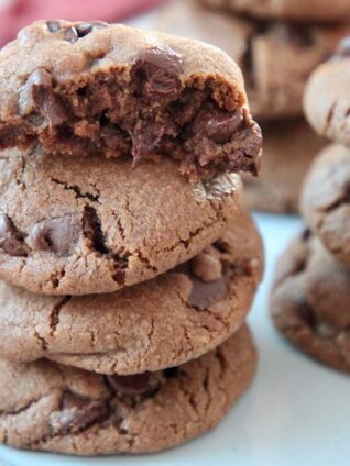 chocolate cookies stacked up on plate