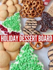 Overhead image of holiday dessert board with pretzels and cookies
