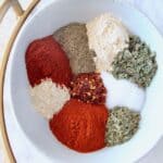 spices and herbs in white bowl