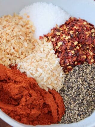 overhead image of spices in white bowl