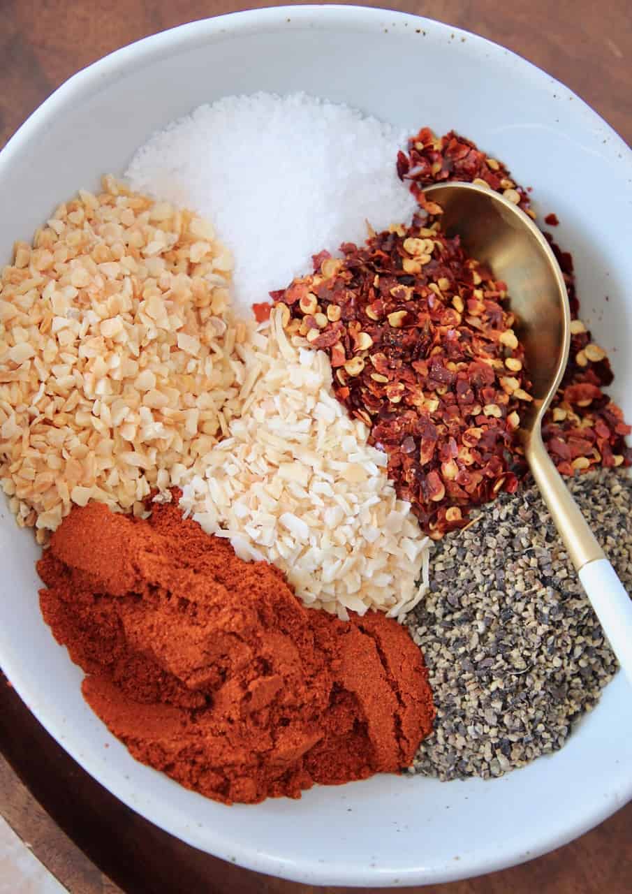 overhead image of spices in bowl with spoon