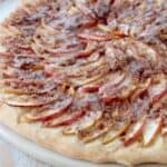 sliced apples on pizza with cinnamon streusel topping