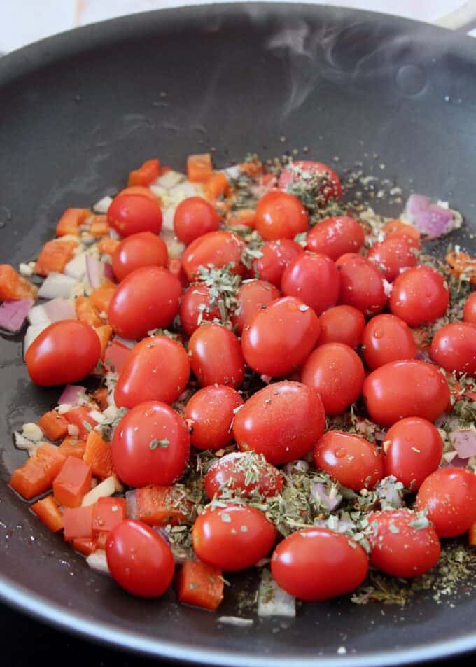 cherry tomatoes with seasonings in a large skillet