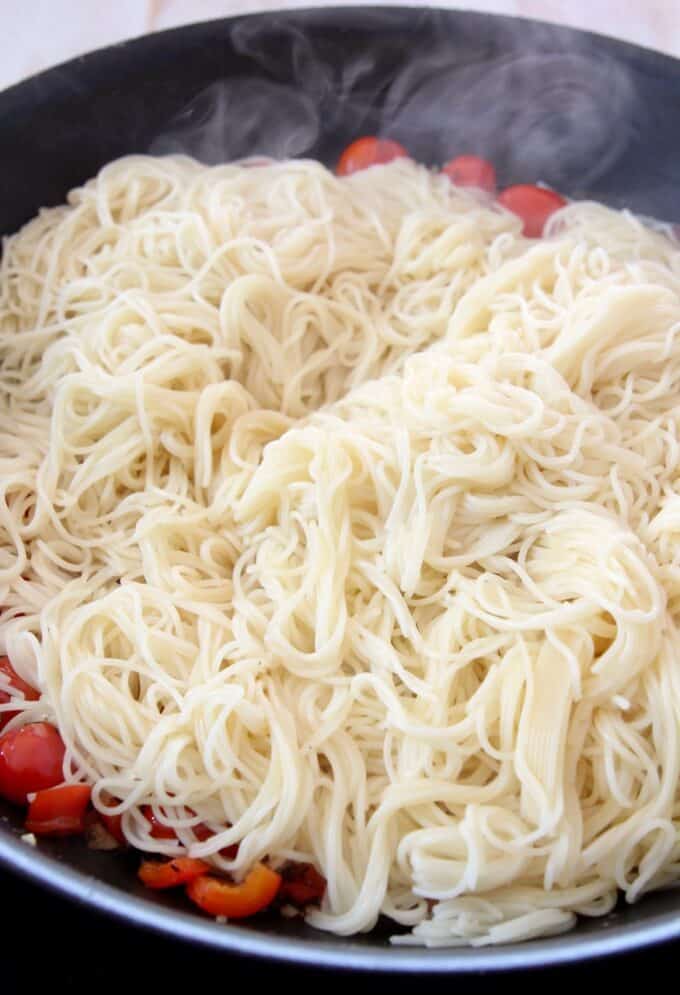 cooked angel hair pasta in a skillet