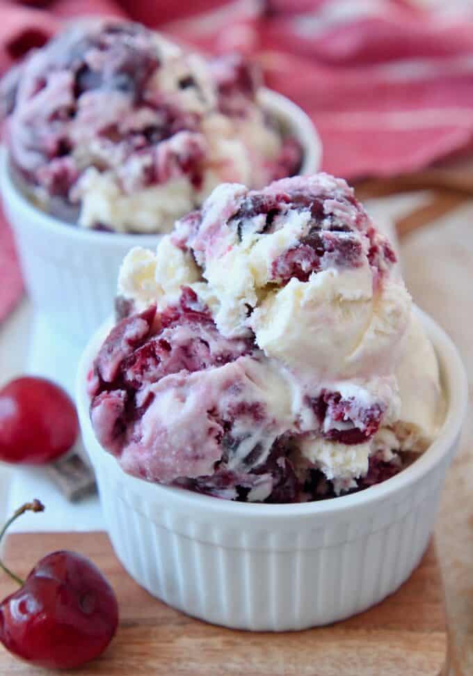 scoops of cherry chocolate ice cream in small white bowls