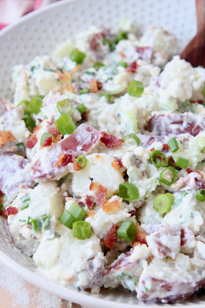 potato salad with bacon and green onions in bowl