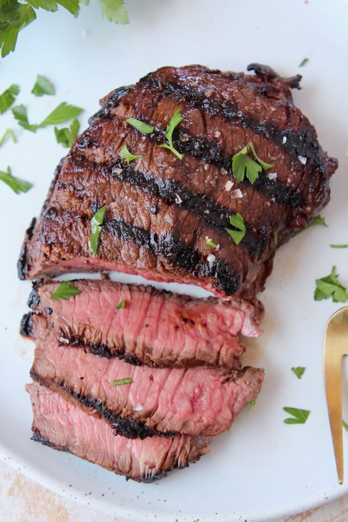 grilled sliced sirloin steak on plate