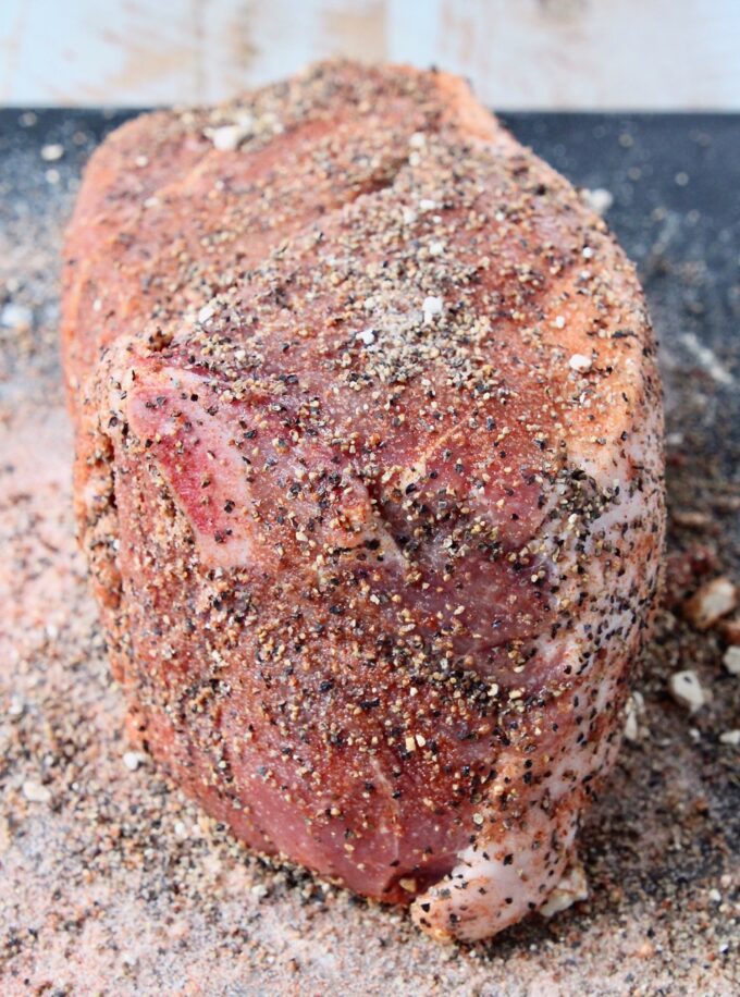 spice rubbed pork shoulder on a cutting board