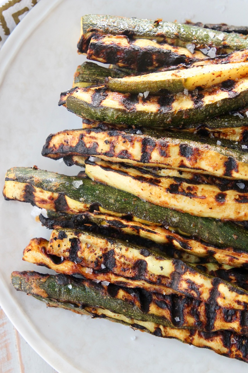 grilled zucchini spears on plate