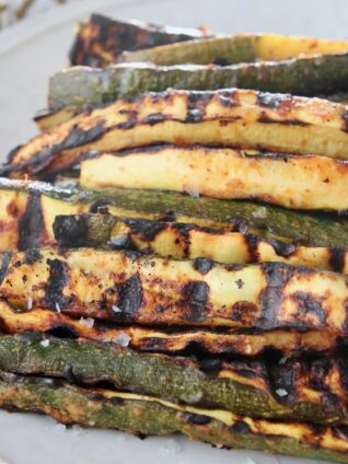 grilled zucchini spears on plate