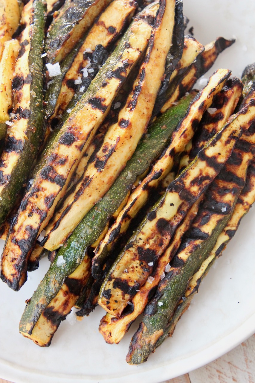 grilled zucchini spears on plate