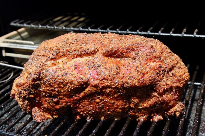 seasoned pork shoulder on grill