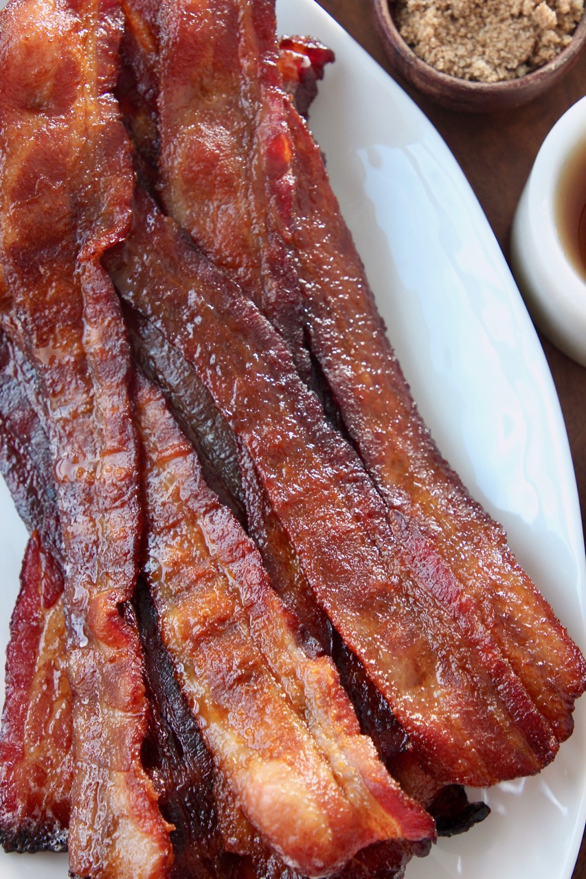 slices of cooked bacon on white plate