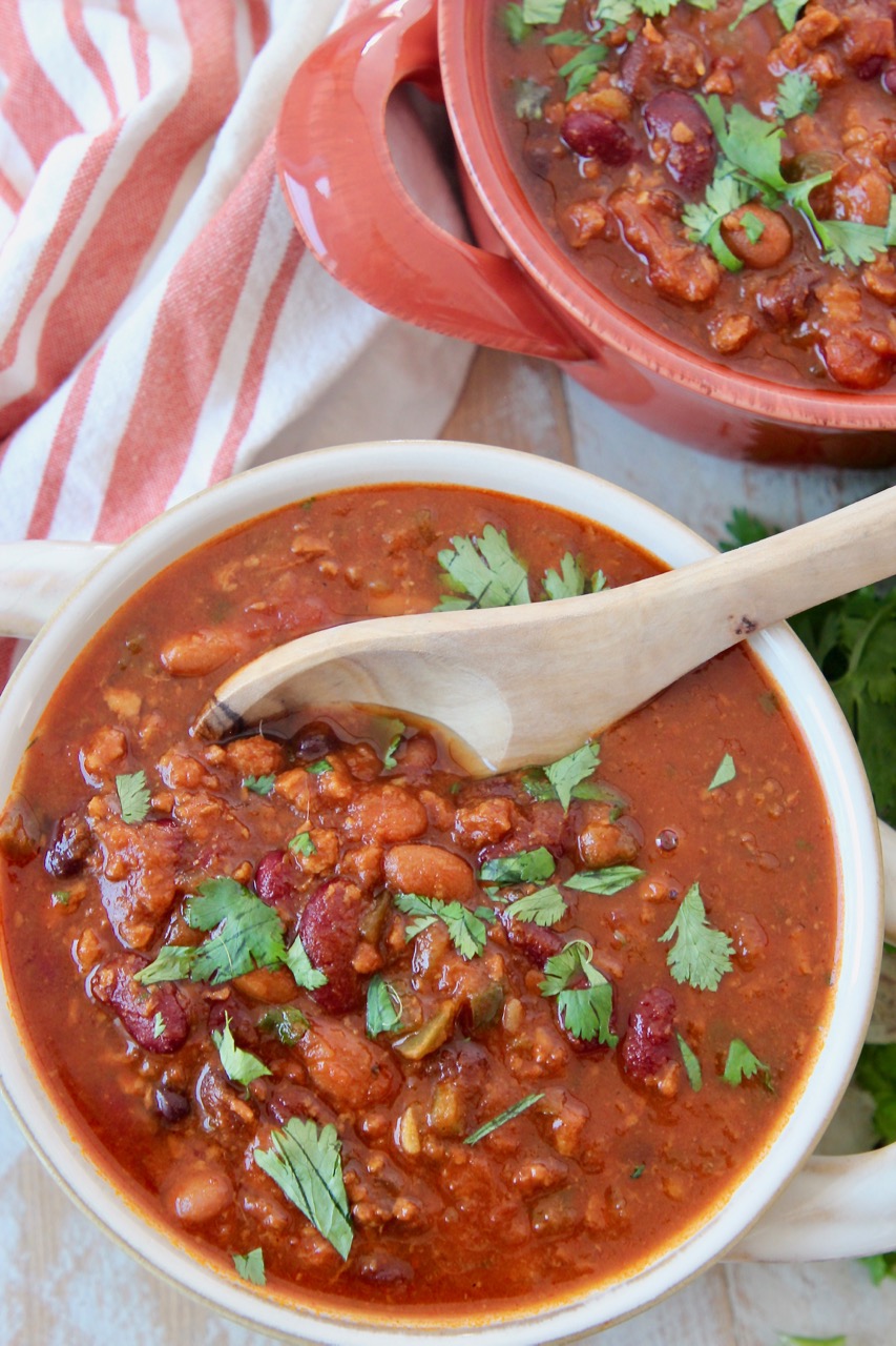 chili in bowl with wood spoon