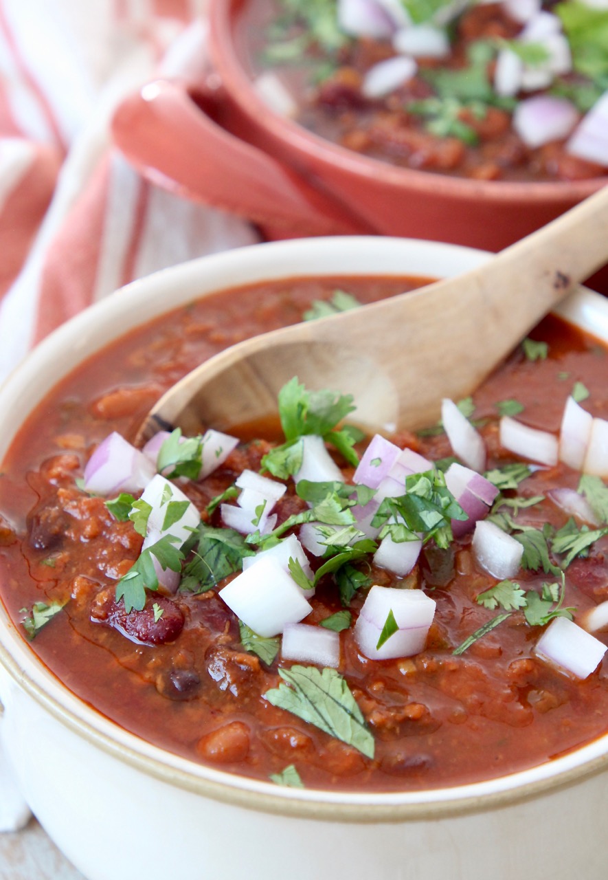 vegan chili in bowl with spoon