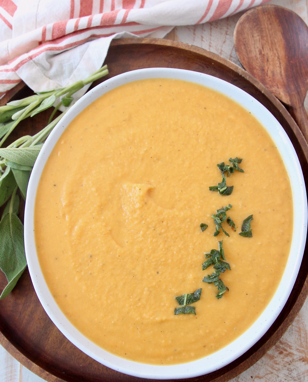 butternut squash sauce in bowl topped with fried sage