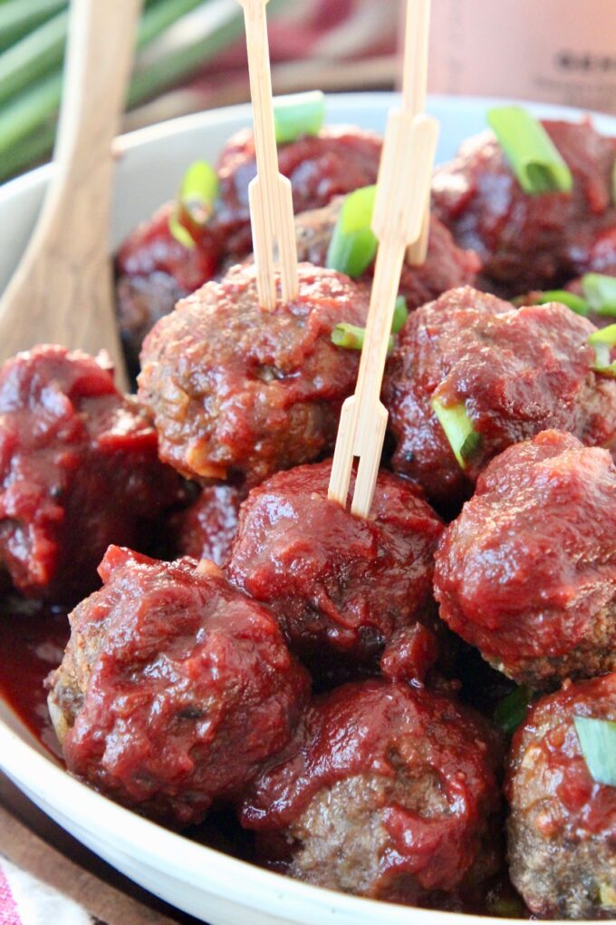 bbq meatballs in bowl with toothpicks in the meatballs