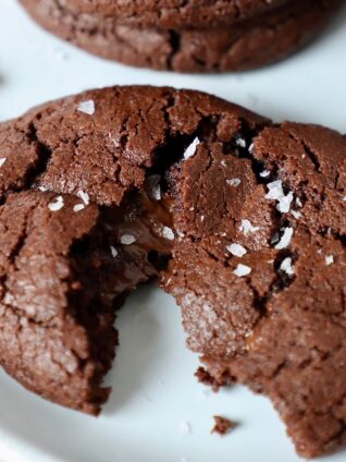 chocolate cookie topped with sea salt on plate