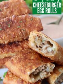 cheeseburger egg rolls cut in half, stacked up on plate