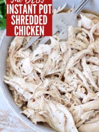 shredded chicken in bowl with serving fork