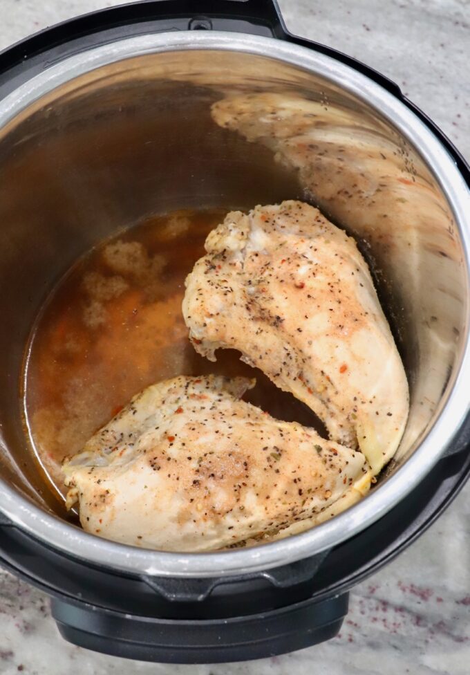 seasoned cooked chicken breasts in an Instant Pot
